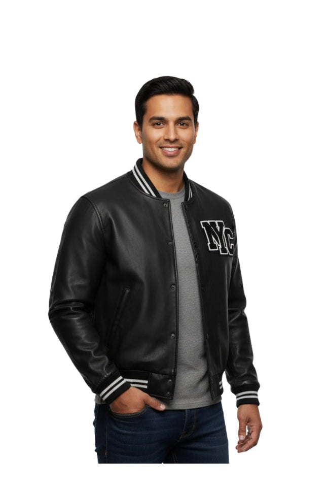 Man wearing a black varsity jacket with 'NYC' on a white background