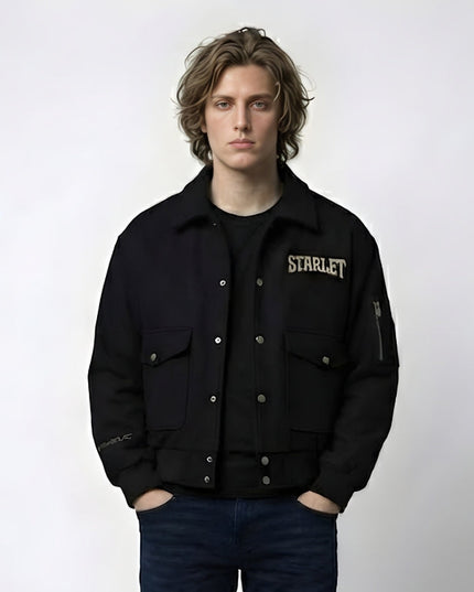 Person wearing a black jacket with 'STARLET' branding on a white background