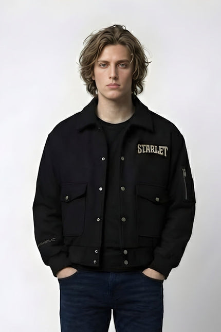 Person wearing a black jacket with 'STARLET' branding on a white background