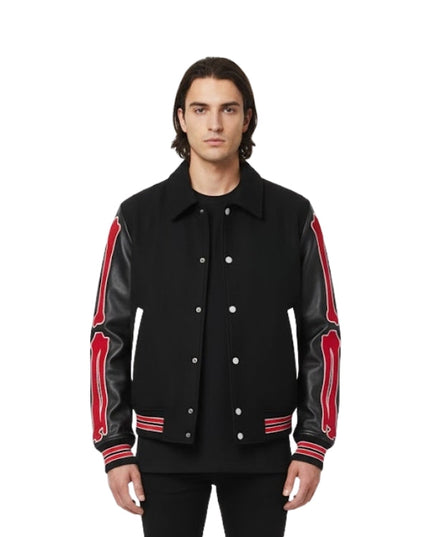 Man wearing a black jacket with red accents on a white background