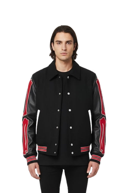 Man wearing a black jacket with red accents on a white background