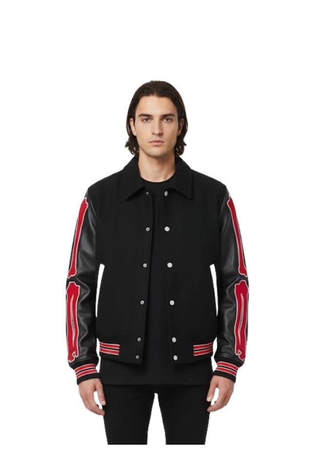 Man wearing a black jacket with red accents on a white background