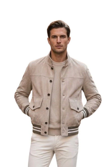 Man wearing a beige varsity jacket on a white background