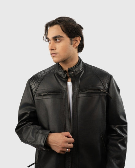 Man wearing a black leather jacket on a white background