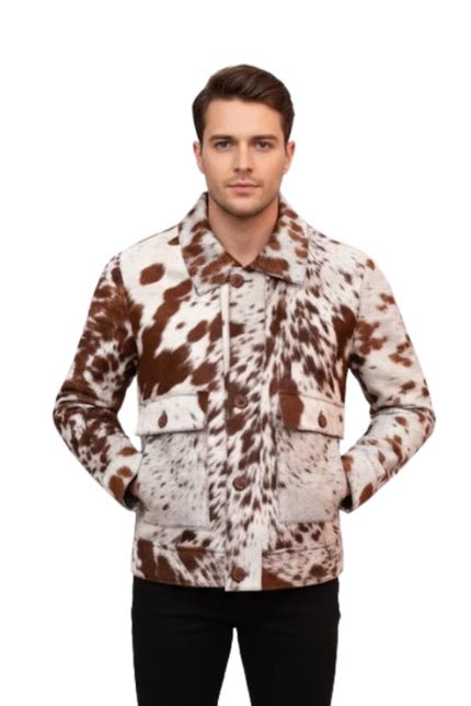 Man wearing a brown and white cow print jacket on a white background