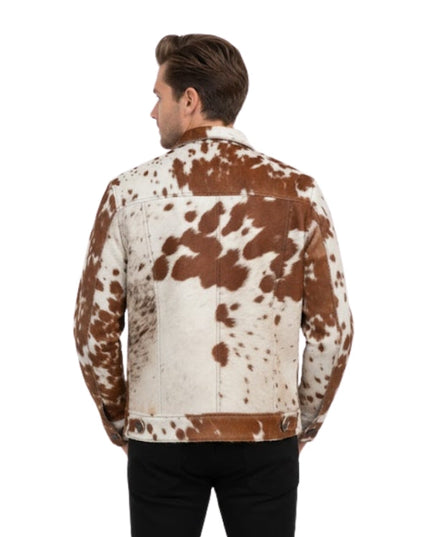 Man wearing a brown and white cowhide leather jacket on a white background