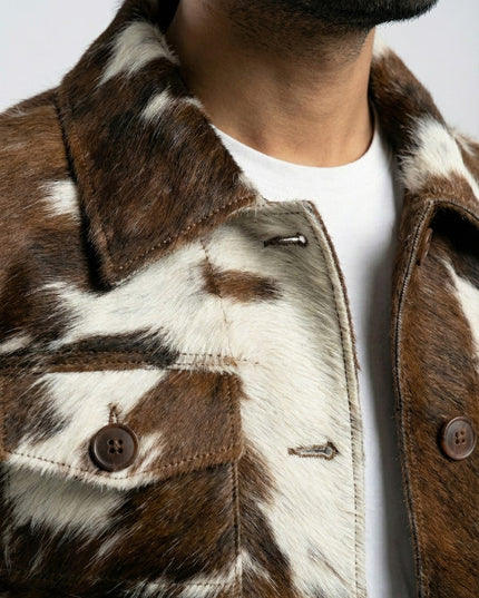 Close-up of a brown and white fur jacket with a neutral background