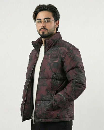 Man wearing a patterned puffer jacket on a white background