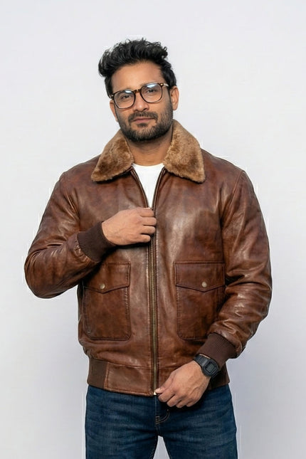 Man wearing a brown leather jacket with fur collar on a white background