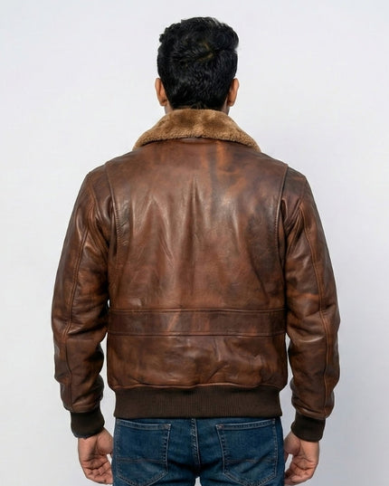 Man wearing a brown leather jacket with fur collar on a white background