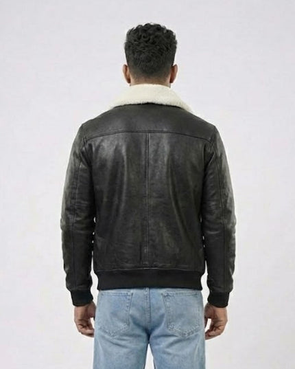 Person wearing a black leather jacket with white fur lining on a white background