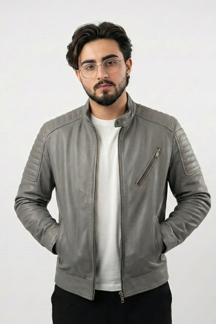 Man wearing a gray leather jacket on a white background