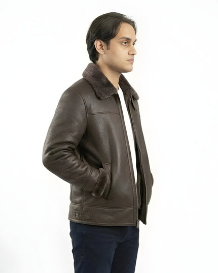 Man wearing a brown leather jacket with fur collar on a white background
