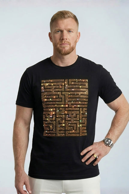 Man wearing a black t-shirt with a unique design on a plain background