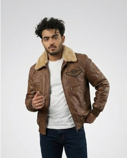 Man wearing a brown leather jacket with fur collar on a white background
