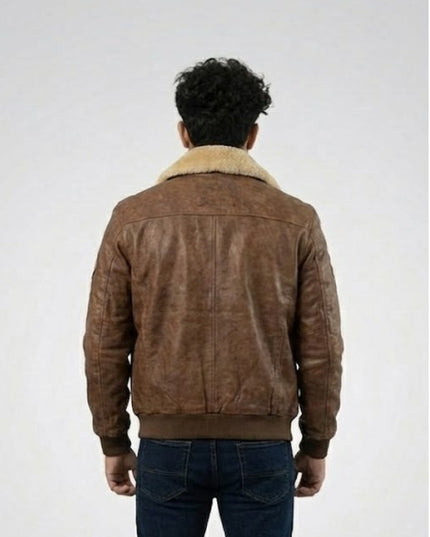 Brown suede jacket with shearling collar worn by a person on a white background