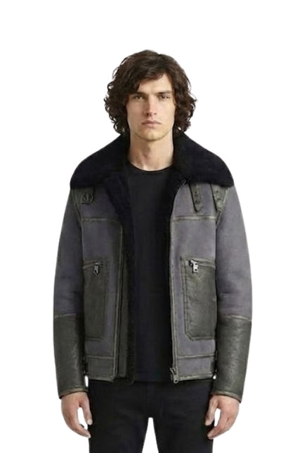 Man wearing a dark gray jacket with black fur collar on a white background