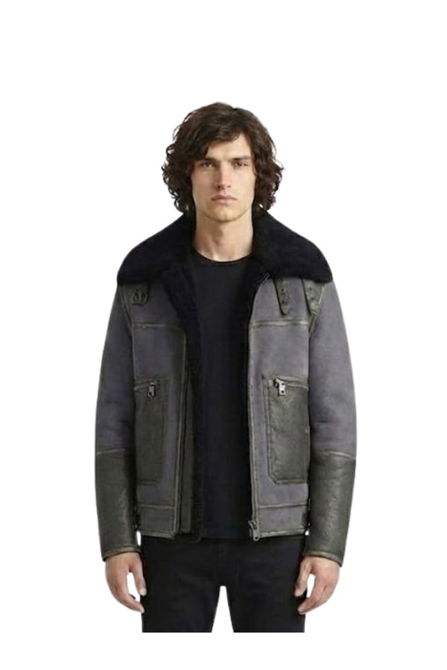 Man wearing a dark gray jacket with black fur collar on a white background