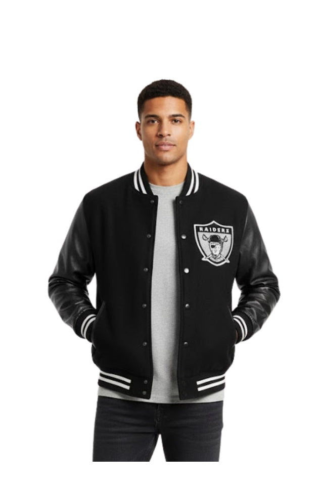 Man wearing a black varsity jacket with a logo on a white background