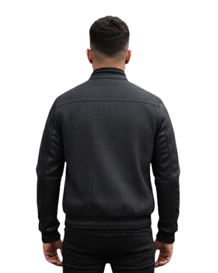 Man wearing a dark gray jacket on a white background