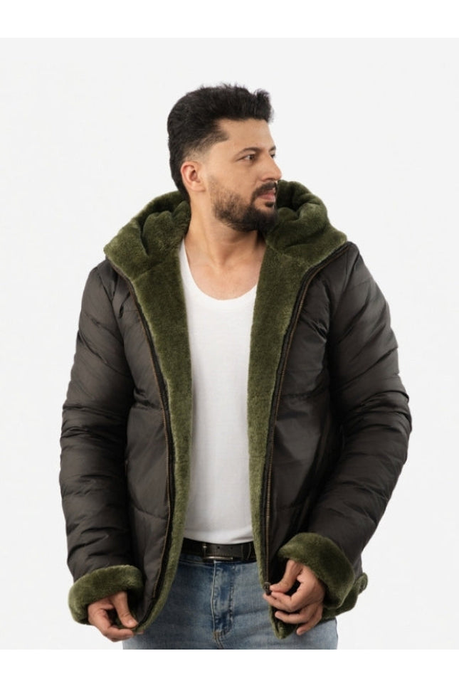 Man wearing a dark green puffer jacket with olive green hood and cuffs on a white background