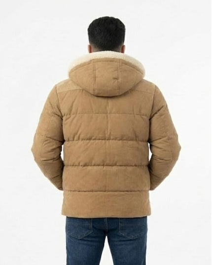 Person wearing a brown puffer jacket with a white background