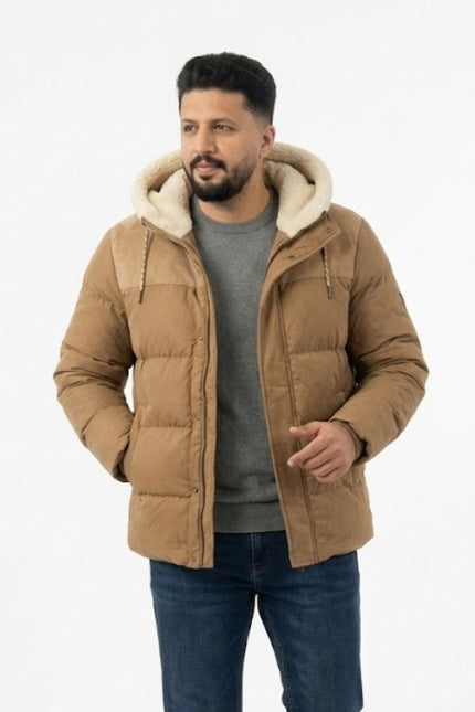 Man wearing a brown puffer jacket with a white hood on a white background