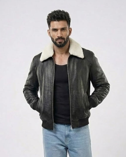 Man wearing a dark leather jacket with white fur lining on a light gray background