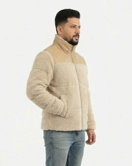 Man wearing a beige fleece jacket on a white background