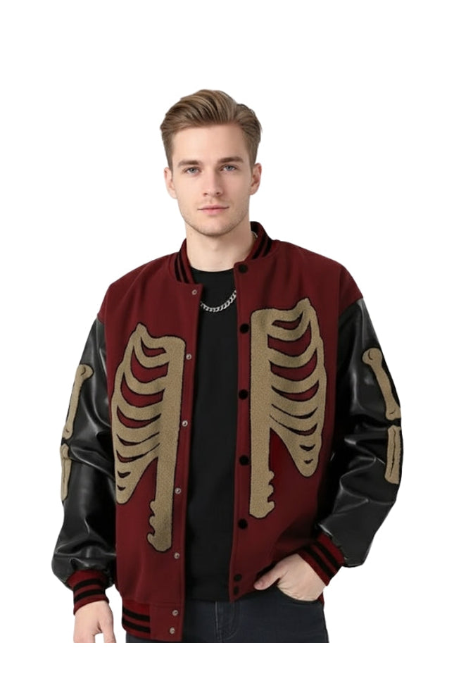 Man wearing a red and black jacket with skeleton designs on a white background