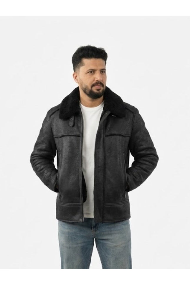 Man wearing a black leather jacket with fur collar on a white background