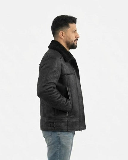 Man wearing a dark gray leather jacket with fur lining on a white background