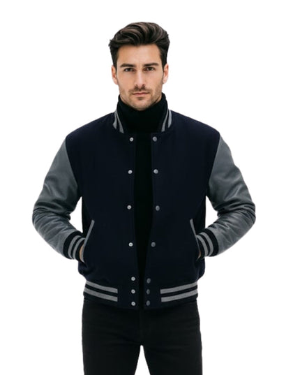 Man wearing a black and gray varsity jacket on a white background