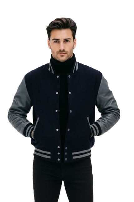 Man wearing a black and gray varsity jacket on a white background