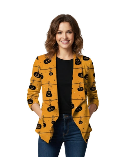 Woman wearing a yellow cardigan with black pumpkin patterns on a white background