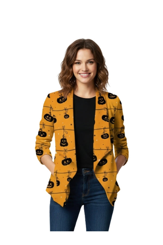 Woman wearing a yellow cardigan with black pumpkin patterns on a white background