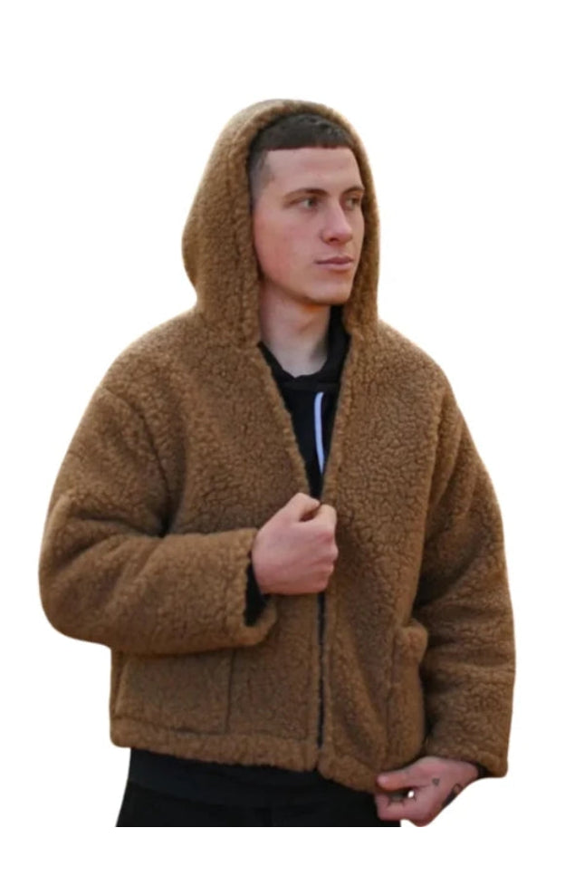 Man wearing a brown hooded jacket on a white background