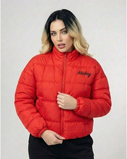 Person wearing a red puffer jacket with 'Mickey' branding on a light gray background
