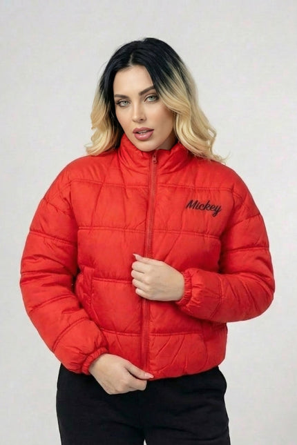 Person wearing a red puffer jacket with 'Mickey' branding on a light gray background