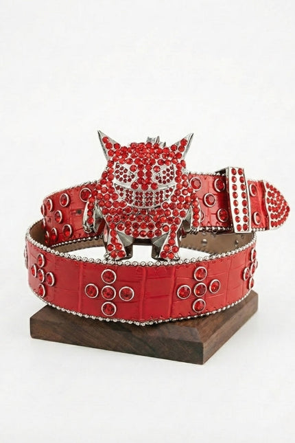 Red belt with a decorative buckle on a white background