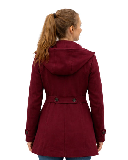Woman wearing a red coat on a white background
