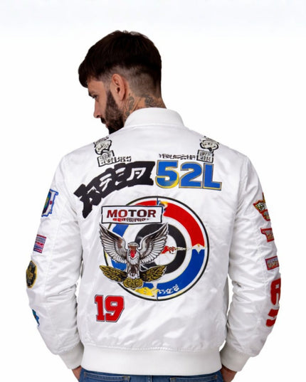 Man wearing a white jacket with colorful graphics and text on the back