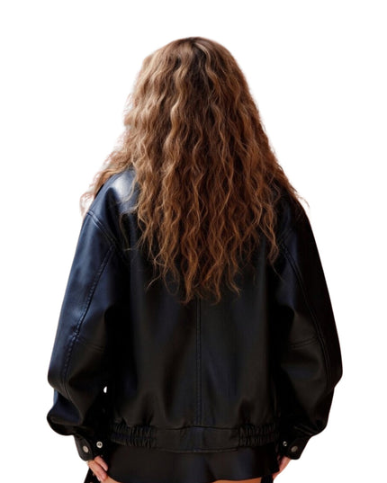 Person wearing a black jacket from behind on a white background