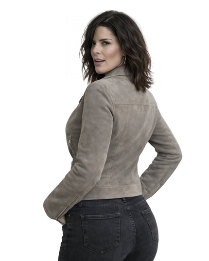 Woman wearing a grey leather jacket on a white background
