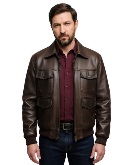 Man wearing a brown leather jacket over a red shirt on a white background