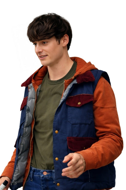 Person wearing a colorful jacket with orange and blue accents on a white background