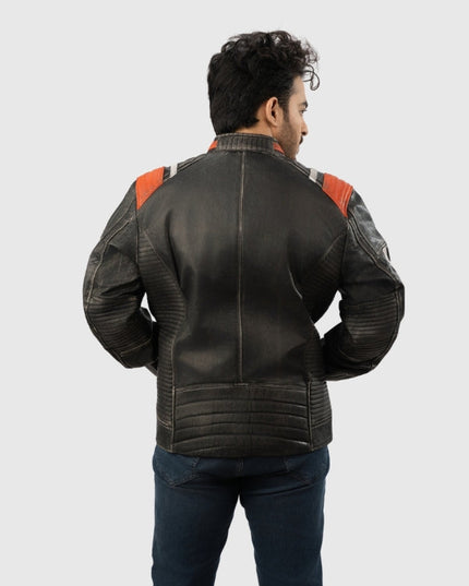 Man wearing a black leather jacket with red accents on a white background