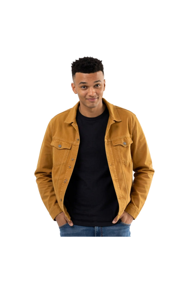 Man wearing a mustard yellow jacket over a black shirt on a white background