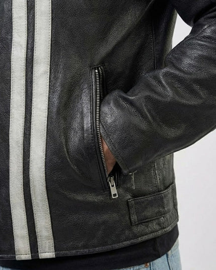 Black leather jacket with white stripes on a gray background