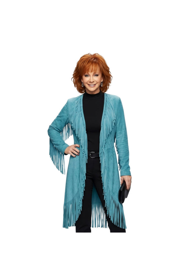 Woman wearing a turquoise fringed jacket on a white background